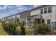 Fenced backyard with lush landscaping and a view of the screened porches, offering a private outdoor retreat at 5054 Kota St, Raleigh, NC 27610