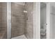 Bathroom shower with tile surround and modern showerhead at 5054 Kota St, Raleigh, NC 27610