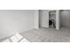 Neutral-colored bedroom with carpet and view of laundry room with a washer and dryer at 5054 Kota St, Raleigh, NC 27610