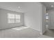 Clean, bright bedroom with neutral carpet and natural light from the window at 5054 Kota St, Raleigh, NC 27610