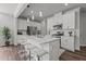 Stylish kitchen with quartz countertops, stainless steel appliances, and convenient island seating at 5054 Kota St, Raleigh, NC 27610