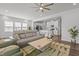 Open-concept living room with a view into the kitchen and modern decor at 5054 Kota St, Raleigh, NC 27610