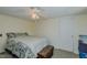 Simple bedroom with a ceiling fan, a window, and door to the side at 5100 Yale Ct, Graham, NC 27253