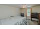 Cozy bedroom with neutral walls, ceiling fan, and natural light from the window at 5100 Yale Ct, Graham, NC 27253