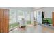 Sunlit entryway with wood floors, ample storage cabinets, and an exterior door at 5100 Yale Ct, Graham, NC 27253