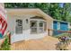 Close-up of front porch, with decorative welcome mat, sidelight and charming features at 5100 Yale Ct, Graham, NC 27253