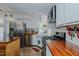 Charming kitchen with white cabinets, stainless appliances, wood countertops, and a farmhouse sink at 5100 Yale Ct, Graham, NC 27253