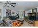 Comfortable living room with stone fireplace, wood floors, and access to a deck at 5100 Yale Ct, Graham, NC 27253