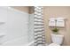 Bright bathroom featuring a bathtub with shower, striped curtain, and neutral paint at 511 Lochalsh Dr, Gibsonville, NC 27249