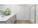 Modern bathroom features a double vanity, quartz countertop, and sleek fixtures creating a spa-like experience at 511 Lochalsh Dr, Gibsonville, NC 27249