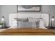A detailed view of headboard featuring throw pillows, bedside lamps, and textured blanket at 511 Lochalsh Dr, Gibsonville, NC 27249