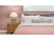 Cozy bedroom featuring a comfortable bed, stylish nightstand with a lamp, and warm, inviting decor at 511 Lochalsh Dr, Gibsonville, NC 27249
