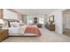 Bright bedroom with large windows, comfortable bed, stylish furniture, and a warm, inviting ambiance at 511 Lochalsh Dr, Gibsonville, NC 27249