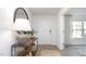 Bright foyer with a decoratively appointed console table and a clear view to the entry door at 511 Lochalsh Dr, Gibsonville, NC 27249