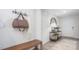 Well-organized foyer with a coat rack, bench, and decoratively appointed console table at 511 Lochalsh Dr, Gibsonville, NC 27249