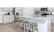 Well-lit kitchen boasts granite countertops, a stainless steel refrigerator, and modern appliances at 511 Lochalsh Dr, Gibsonville, NC 27249