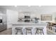 Bright kitchen features a large island with granite countertops and stainless steel appliances at 511 Lochalsh Dr, Gibsonville, NC 27249