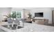 Open-concept living room featuring stainless steel sink, and ample natural light at 511 Lochalsh Dr, Gibsonville, NC 27249