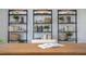 Close-up of the office shelving with vases, baskets, books, and plants at 511 Lochalsh Dr, Gibsonville, NC 27249