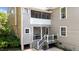 View of a two-story back porch and yard of the home at 518 S Main St, Wake Forest, NC 27587