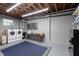 Bright basement featuring a washer, dryer, and storage cabinets at 518 S Main St, Wake Forest, NC 27587