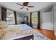Comfortable bedroom featuring a bed with a patterned rug and plenty of natural light from the windows at 518 S Main St, Wake Forest, NC 27587