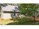 Exterior view of detached garage showing siding and grass yard and trees at 518 S Main St, Wake Forest, NC 27587