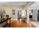 Inviting hallway with gleaming hardwood floors and easy access to multiple rooms at 518 S Main St, Wake Forest, NC 27587