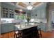 Stylish kitchen featuring custom cabinetry, granite countertops, and a spacious island with seating at 518 S Main St, Wake Forest, NC 27587