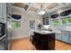 Beautiful kitchen with coffered ceilings, granite countertops, stainless steel appliances, and an island with seating at 518 S Main St, Wake Forest, NC 27587