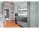 Modern kitchen boasting stainless steel appliances, custom cabinets and hardwood floors at 518 S Main St, Wake Forest, NC 27587