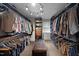 Large walk-in closet featuring custom shelving and organization systems at 518 S Main St, Wake Forest, NC 27587