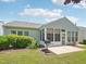 Inviting screened-in patio with a grill, enhanced by lush landscaping, perfect for relaxation and entertaining at 519 Garendon Dr, Cary, NC 27519