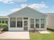 Inviting screened-in patio with access to backyard, offering a seamless transition between indoor and outdoor spaces at 519 Garendon Dr, Cary, NC 27519