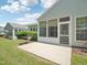 Cozy screened-in patio with a grill and concrete floors, perfect for outdoor dining and relaxation at 519 Garendon Dr, Cary, NC 27519