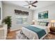 Bright bedroom with a ceiling fan, window with blinds, and stylish decor at 519 Garendon Dr, Cary, NC 27519