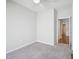 Carpeted bedroom featuring an open door to the ensuite bathroom and neutral walls at 519 Garendon Dr, Cary, NC 27519