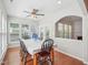 Inviting dining area with hardwood floors, large window, and a ceiling fan at 519 Garendon Dr, Cary, NC 27519