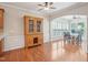 Formal dining room featuring hardwood floors, a ceiling fan, and natural light from large windows at 519 Garendon Dr, Cary, NC 27519