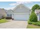 Charming one-story home with a two-car garage, well-maintained landscaping and lovely curb appeal at 519 Garendon Dr, Cary, NC 27519