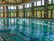 Spacious indoor pool with lane dividers and ample natural light from surrounding windows at 519 Garendon Dr, Cary, NC 27519