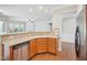 Bright kitchen with stainless steel appliances, wooden cabinets and breakfast bar at 519 Garendon Dr, Cary, NC 27519