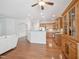 Spacious living room with hardwood floors, white sofa, and open layout to the kitchen at 519 Garendon Dr, Cary, NC 27519
