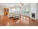 Bright living room with a fireplace, natural light, and hardwood floors, perfect for relaxation at 519 Garendon Dr, Cary, NC 27519
