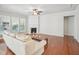 Spacious living room boasts a cozy fireplace, hardwood floors, and lots of natural light at 519 Garendon Dr, Cary, NC 27519