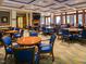 Well-lit meeting room furnished with round tables and blue upholstered chairs at 519 Garendon Dr, Cary, NC 27519