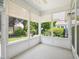 Sunroom with large windows and white trim, offering bright, natural light and lovely views of the outdoors at 519 Garendon Dr, Cary, NC 27519