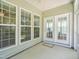 Bright sunroom featuring beautiful windows, neutral walls, and a patio door that leads to the backyard at 519 Garendon Dr, Cary, NC 27519