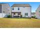 Spacious backyard with a dining area under a pergola, ideal for outdoor entertaining at 521 Glenwyck Ct, Fuquay Varina, NC 27526