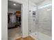 Bright bathroom featuring glass shower and walk-in closet at 521 Glenwyck Ct, Fuquay Varina, NC 27526